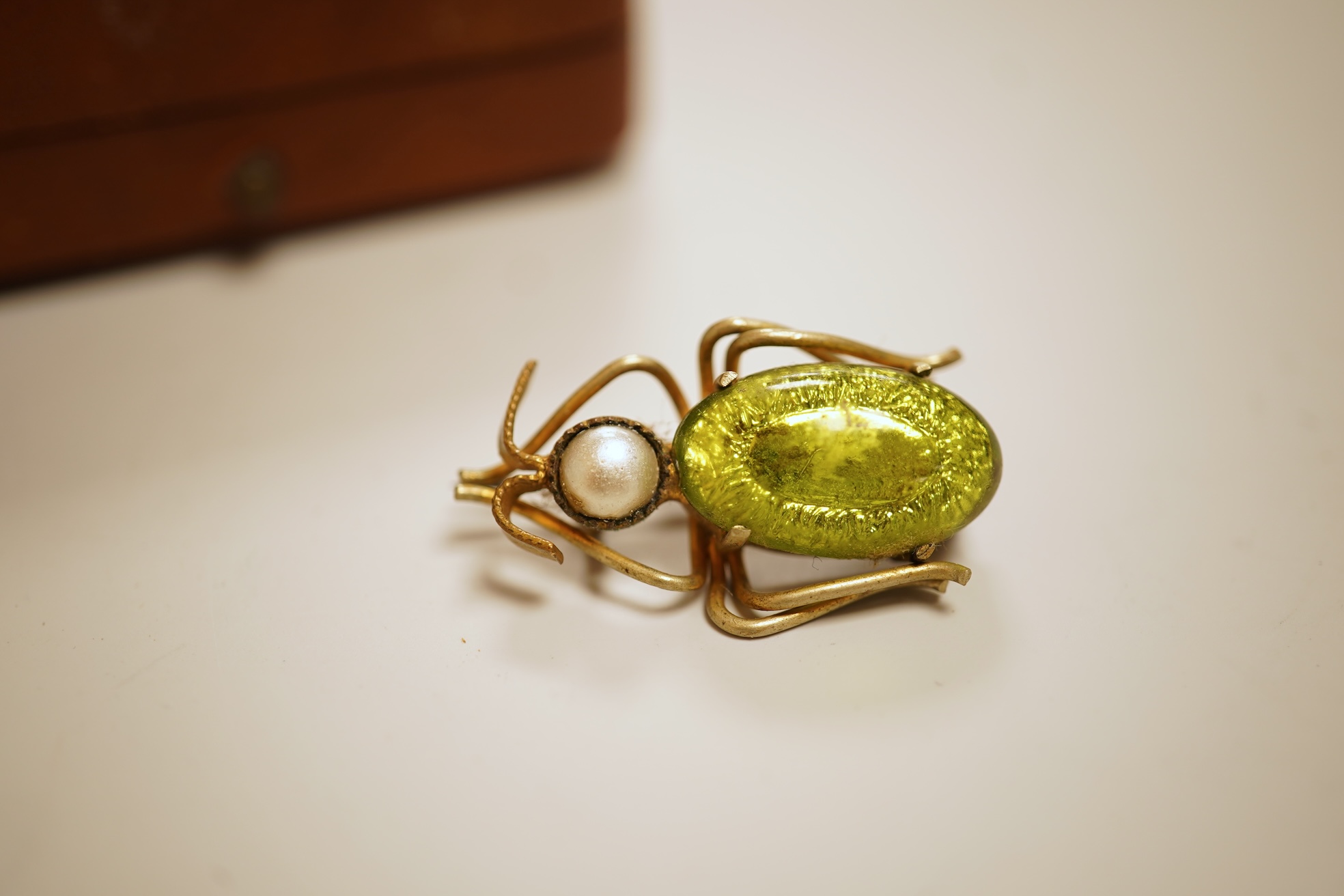 A small group of assorted jewellery including a gold plated curb link bracelet, silver brooch, simulated pearl necklace and costume.